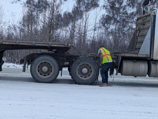 Kelton's short sleeved hero changing tire chains