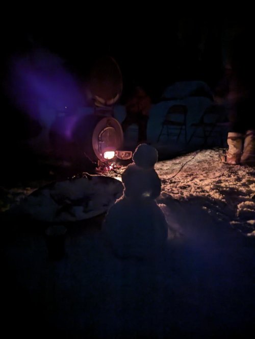 Snowman at the wood stove