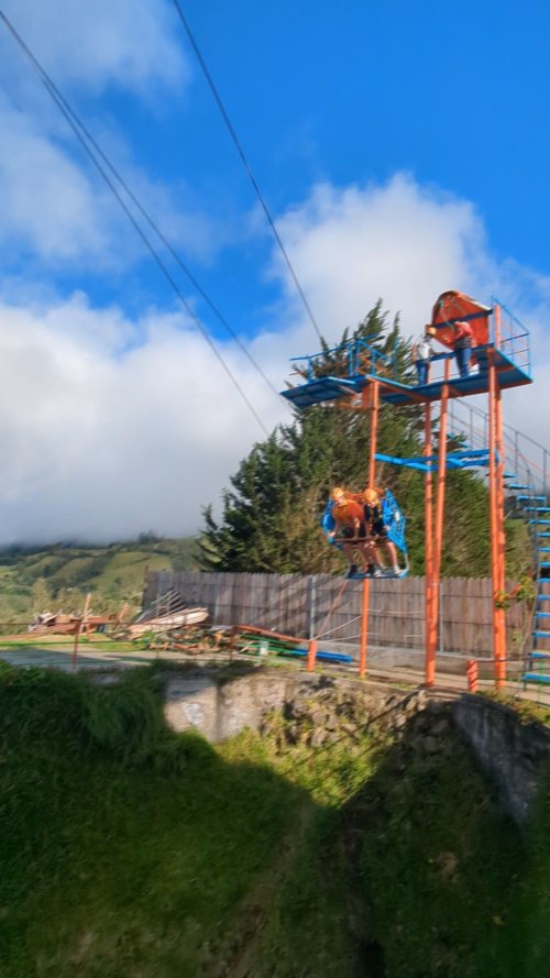 Banos, Swing at the End of the World - Carter and Kelton taking off